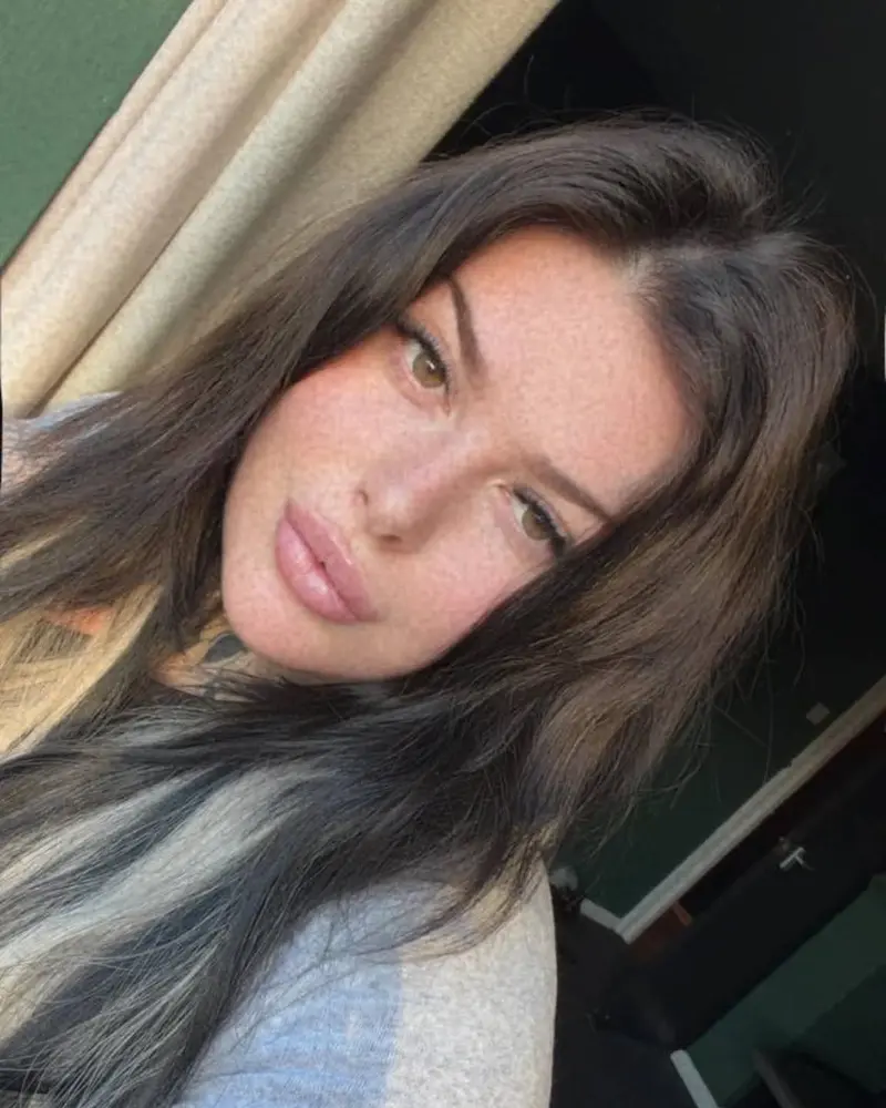 Melissa Thornton, owner of Get Lippy with Mel, with long dark hair and freckles